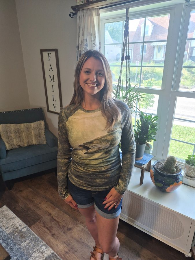 Customer wearing women's Timber Bass Sunray shirt