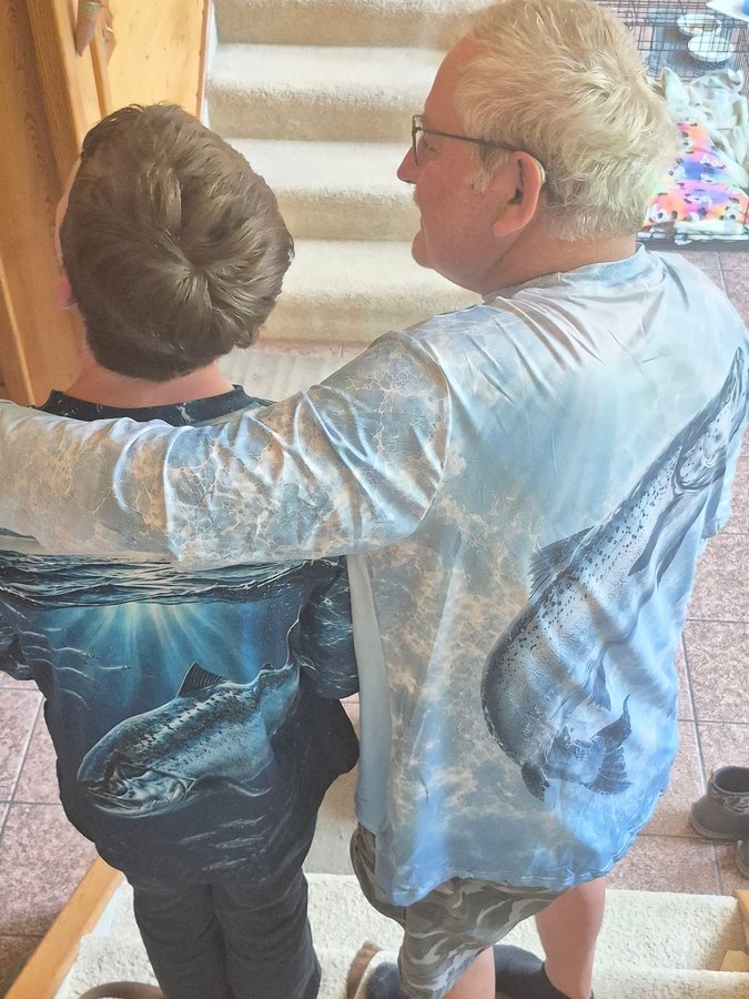 Grandpa and grandson in matching salmon shirts